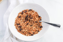 Load image into Gallery viewer, cinnamon raisin granola in white bowl with spoon.