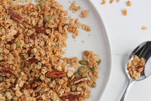 Load image into Gallery viewer, maple pecan on plate with spoonful of granola.